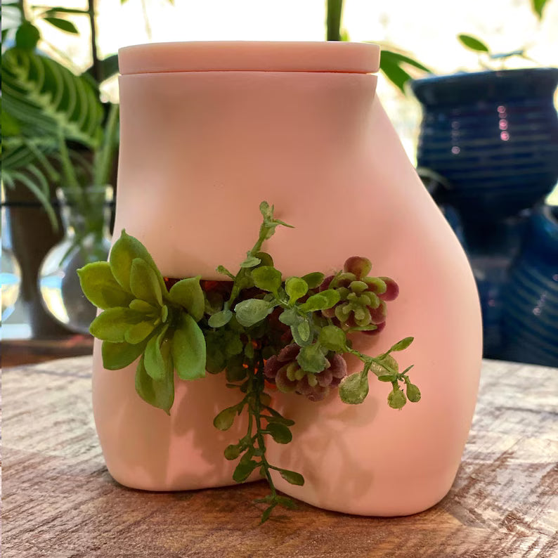 Female body buttocks bush flower pot